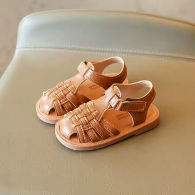 Flat fashion kids sandals in solid colors with adjustable straps, perfect for summer wear.
