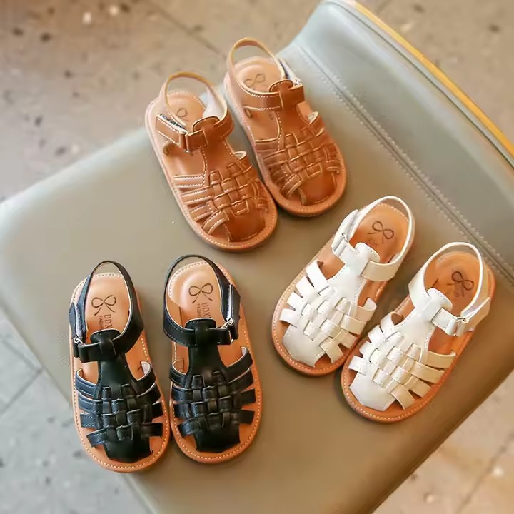 Flat fashion kids sandals in solid colors with adjustable straps, perfect for summer wear.