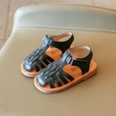Flat fashion kids sandals in solid colors with adjustable straps, perfect for summer wear.