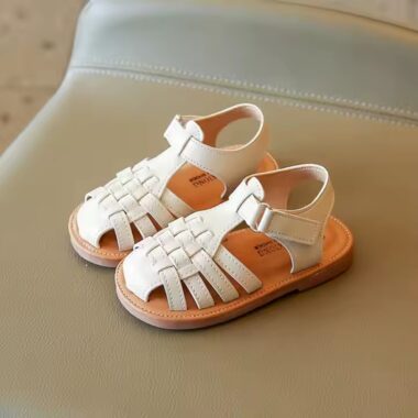 Flat fashion kids sandals in solid colors with adjustable straps, perfect for summer wear.