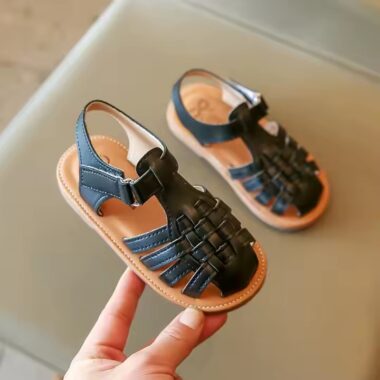 Flat fashion kids sandals in solid colors with adjustable straps, perfect for summer wear.