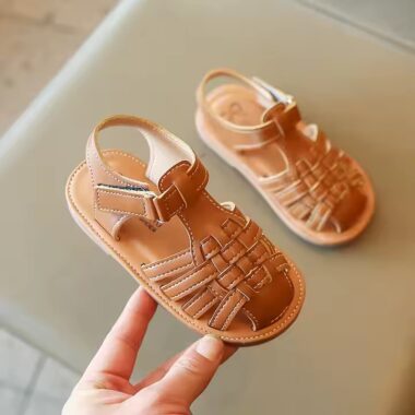 Flat fashion kids sandals in solid colors with adjustable straps, perfect for summer wear.